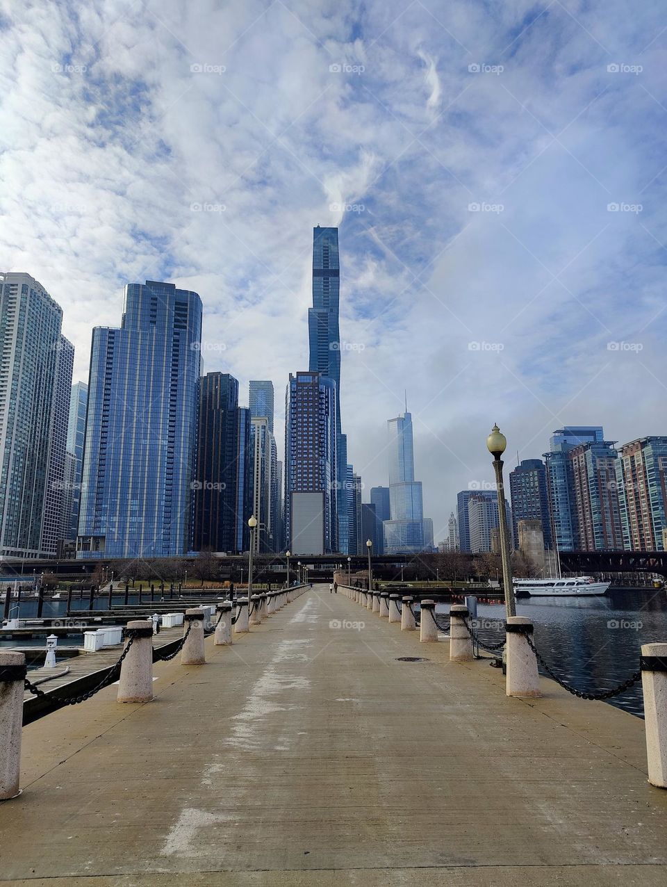 View on the skyline of Chicago city centre in clouds and mist on a cold day from the pier.