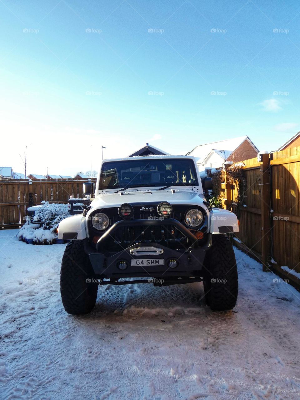 White Wrangler Jeep in the snow