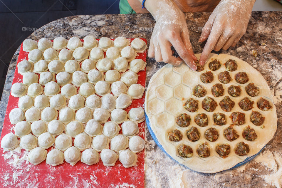 Women making meat dumplings