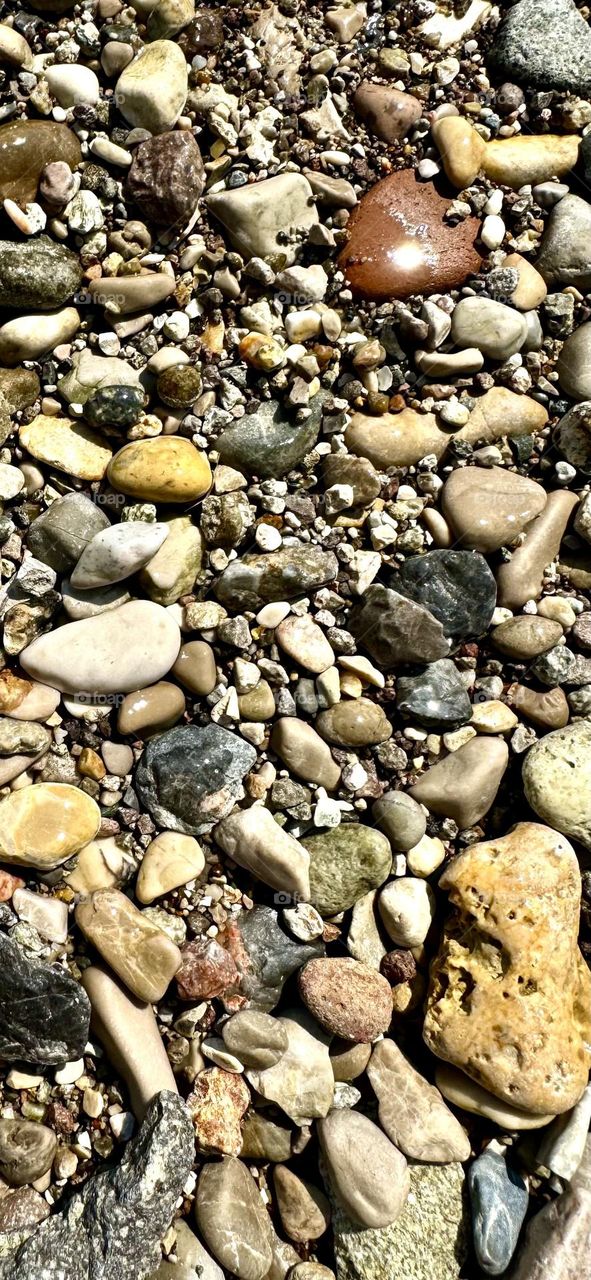 Wet sea pebbles. Sea stones. Background. 