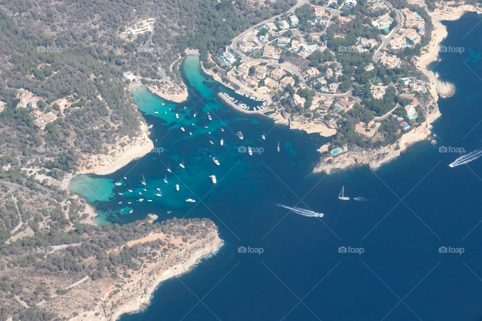 View from airplane, flying over beaches on Mallorca, vacation 