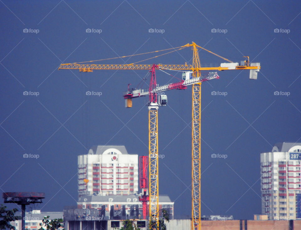 Building site cranes against an approaching storm in Moscow, Russia