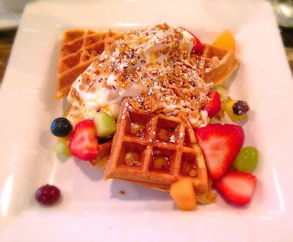 Healthy breakfast . Waffles, homemade yogurt, and fresh fruit - healthy meal mission