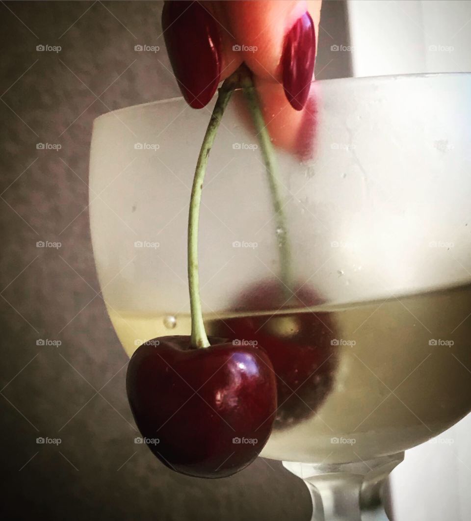 ripe sweet cherry in ice champagne