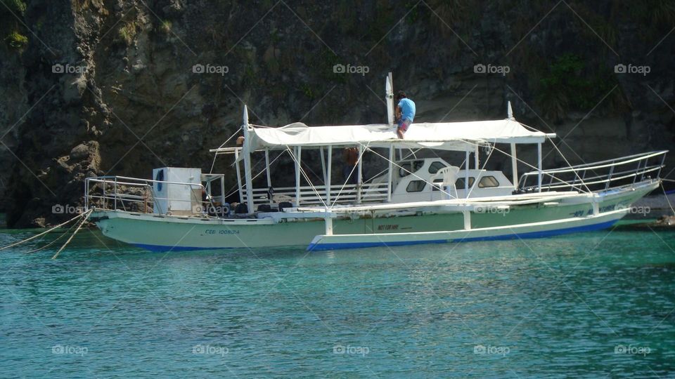 white boat in the turquoise colored water
