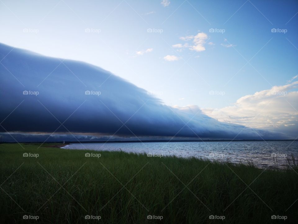 A storm with a sunny weather above in the Cape Bear, Prince Edward Island, Canada