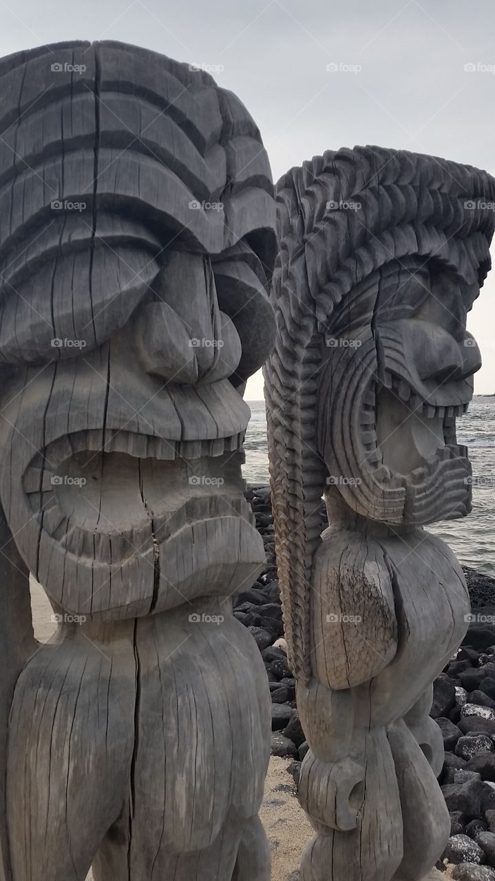 Ancient Polynesian style tiki wooden carvings at Ki'i Pu'uhonua O Honaunau National Park