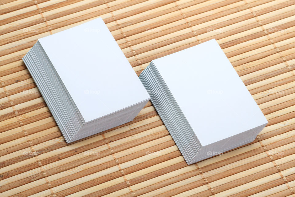 Set of blank white business cards on wooden background