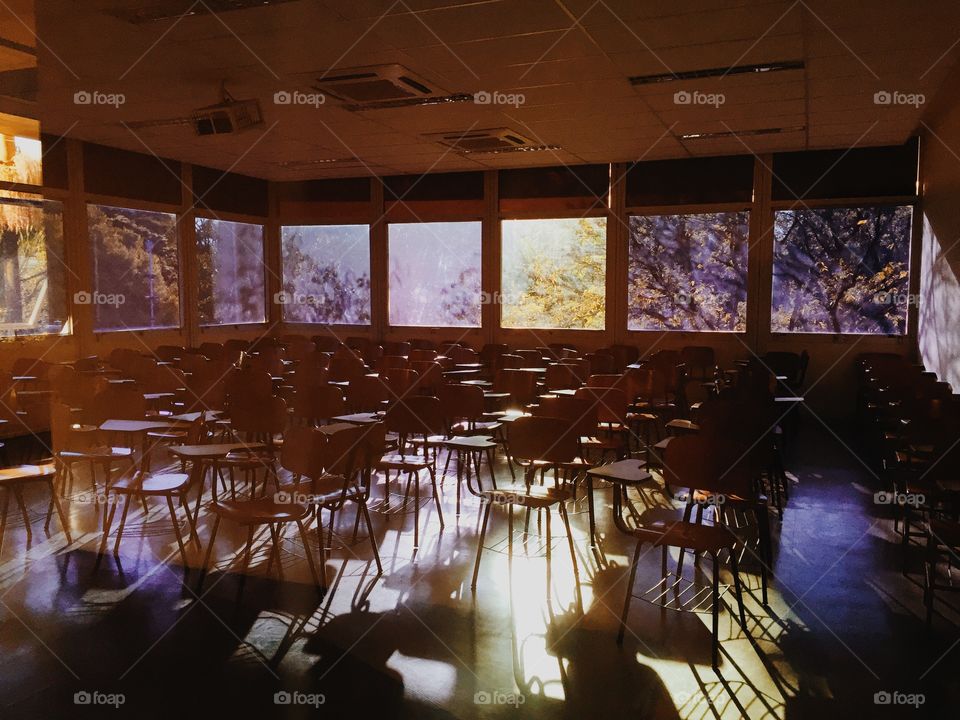 Classroom Lit by Afternoon Sun. Walking past an ordinary classroom, noticed how the lighting created this astonishing atmosphere and took a shot! 