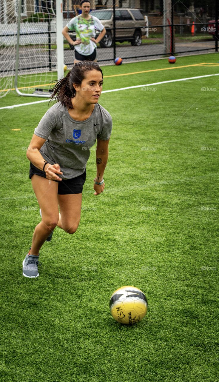 Tattooed girl plays soccer