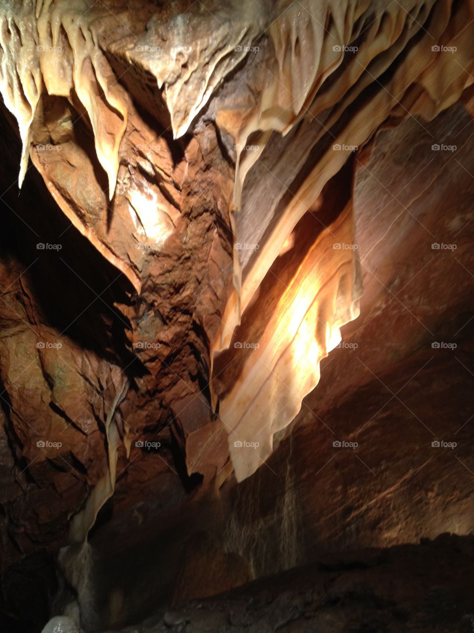Low angle view of cavern with stalactites