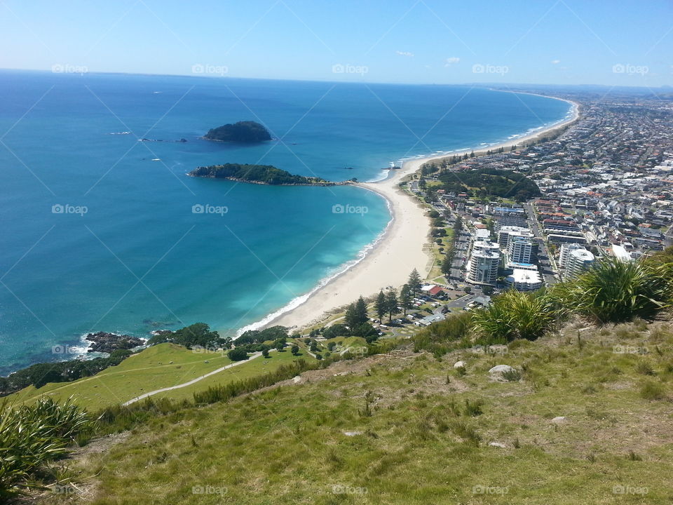 On top of Mt. Mauganui in New Zealand. Look at that water!
