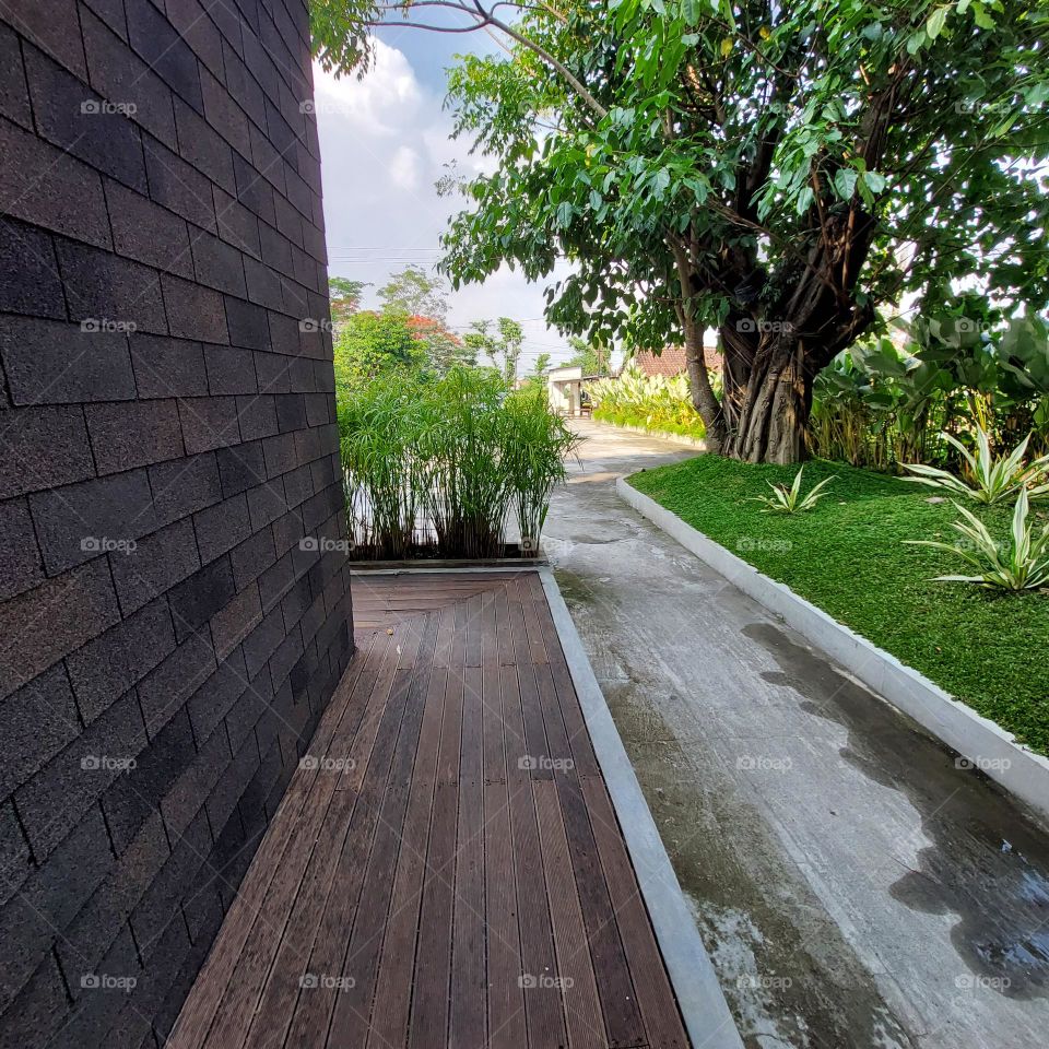 a building surrounded by a beautiful garden