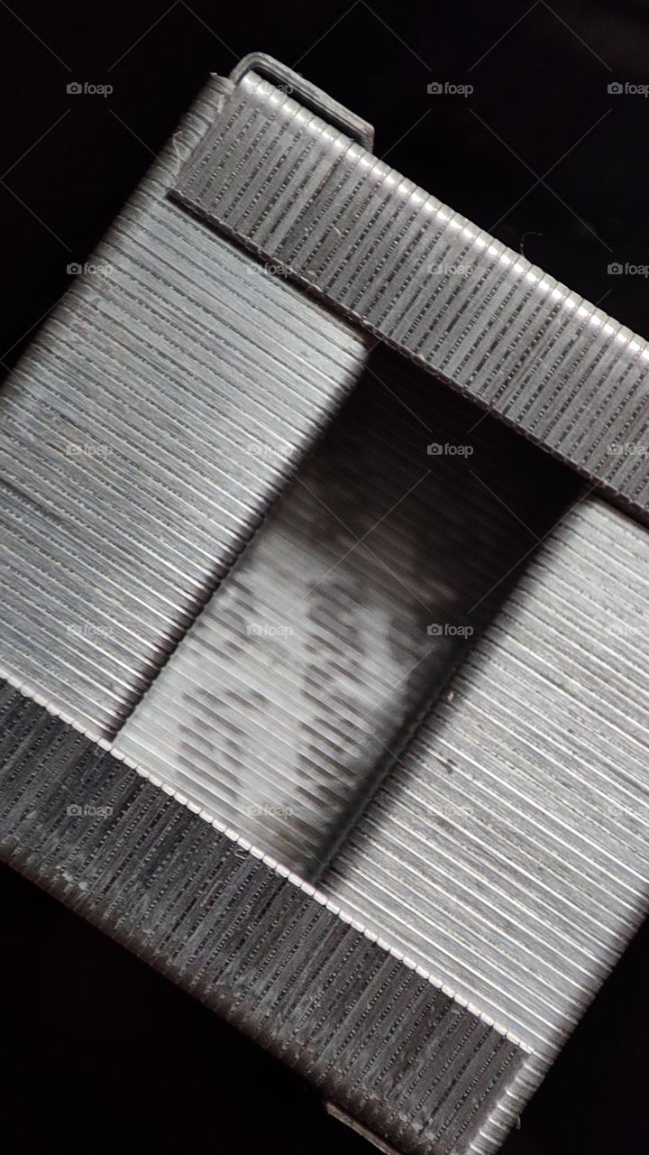 Stapler pin cube closeup