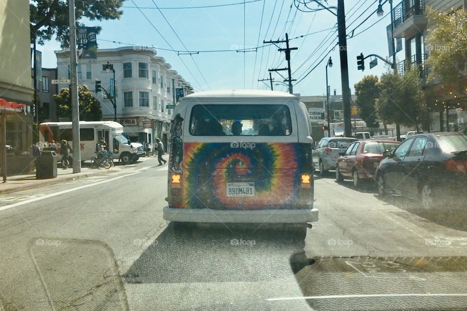 Rainbow-colored wagon on the street 