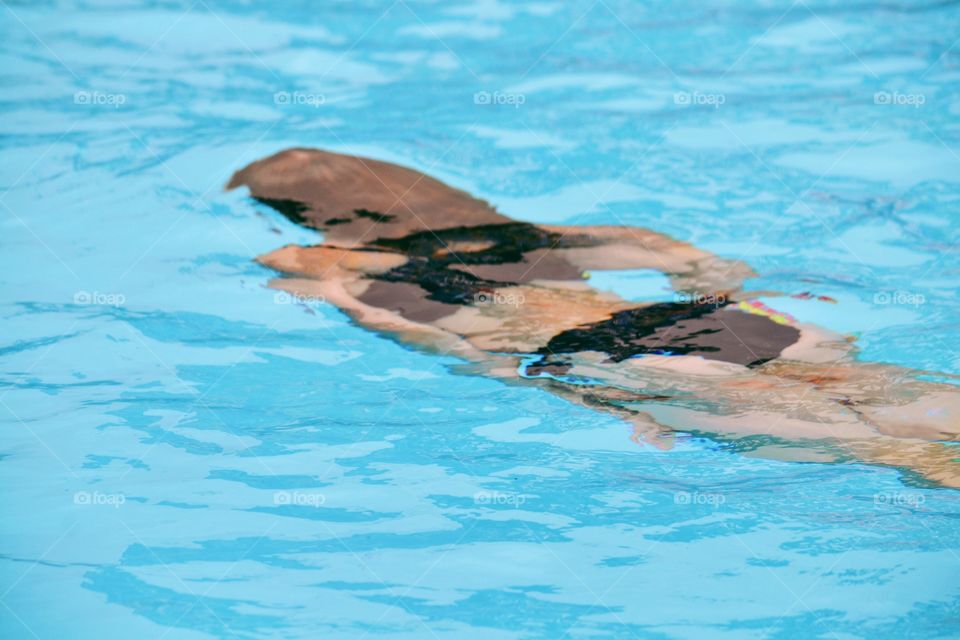 Girl swimming under water