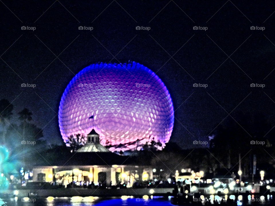 Spaceship Earth shines brightly at the entrance to EPCOT at the Walt Disney World Resort in Orlando, Florida.