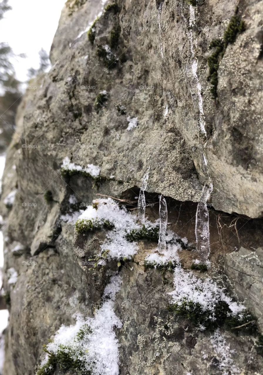 Icicles on rocks