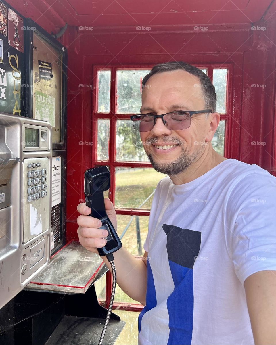 Nice man, nice smile. Smartphone selfie. Good mood, nice vibes. Summer time. Sunny day . Man and phone.