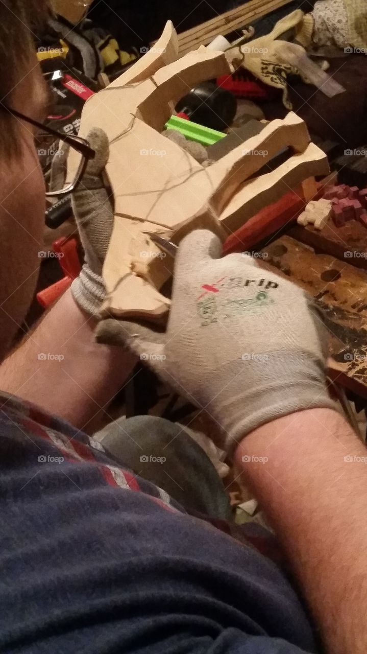 My brother carves animals out of wood. Here he is carving a horse