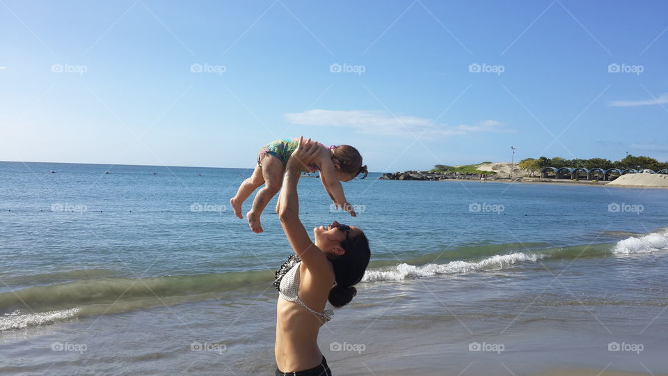 Mother and child in the beach 