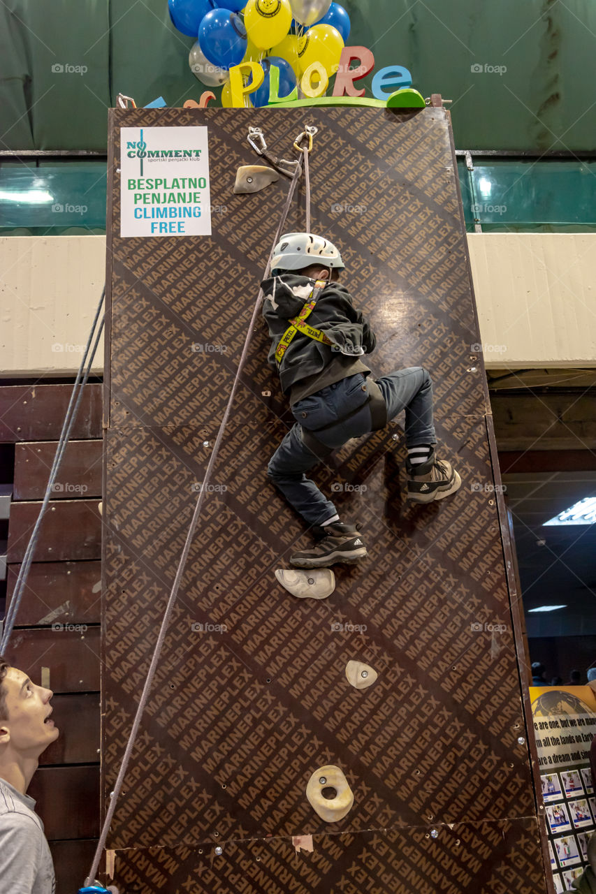 Boy climbing on the wall