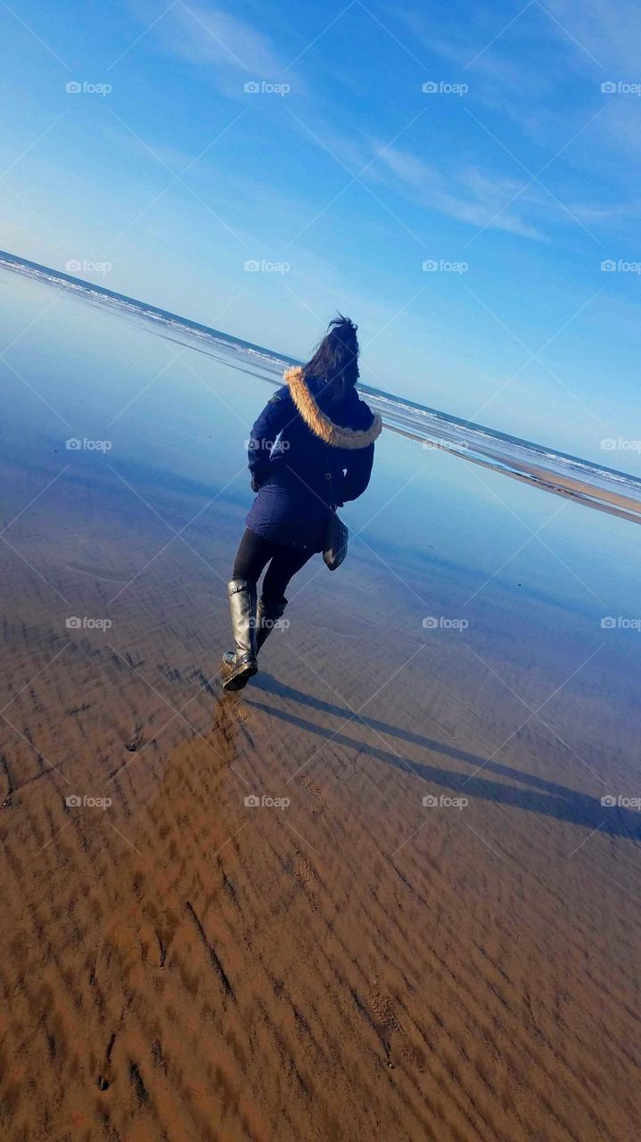 woman walking on the beach