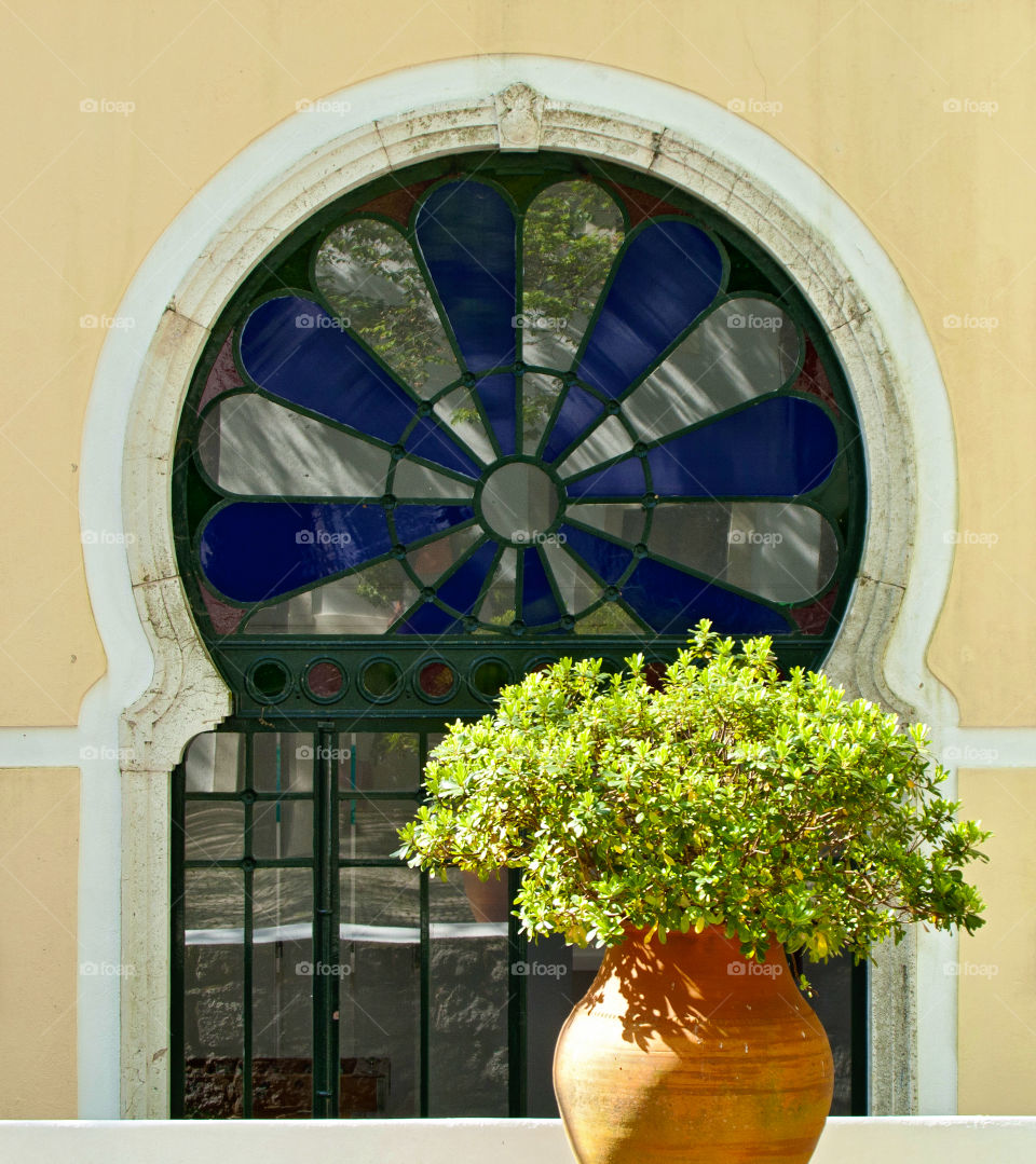 Livingroom window. Round window with blue glas 