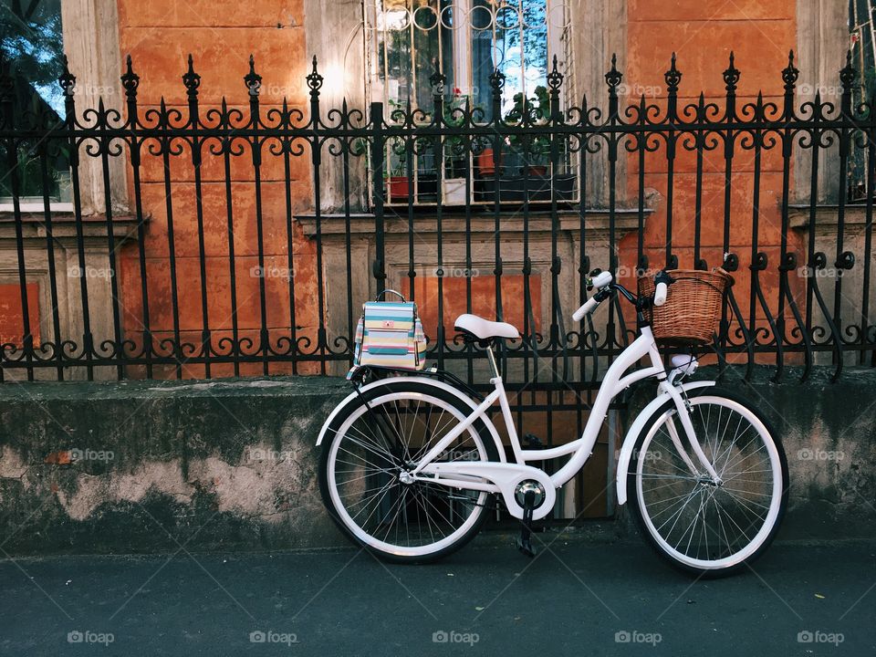 Retro bicycle near orange wall
