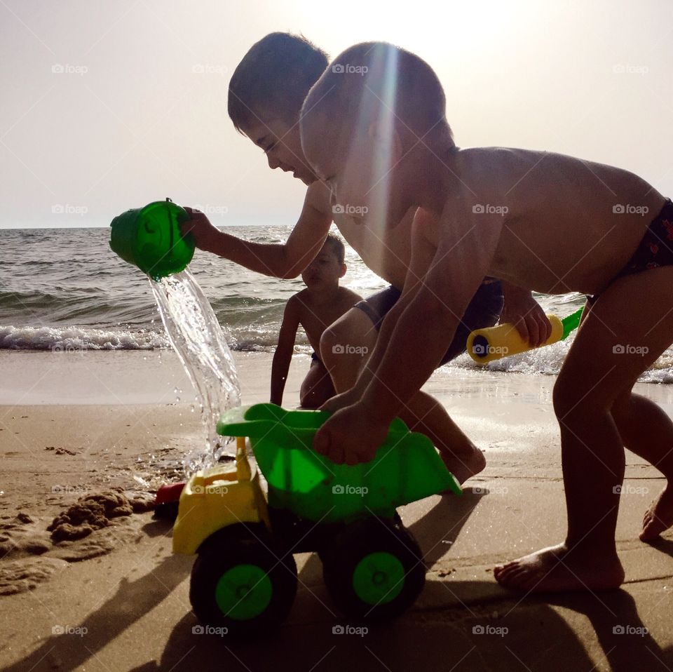 Boys playing at beach