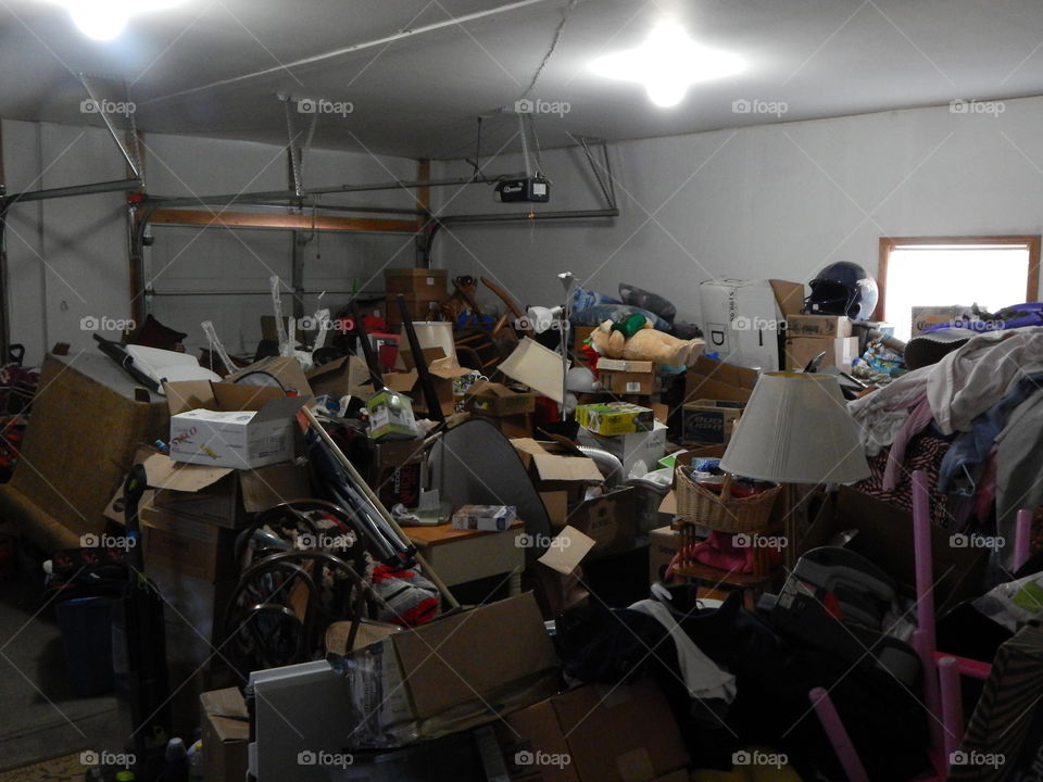 The chaotic mess in a garage after moving.
