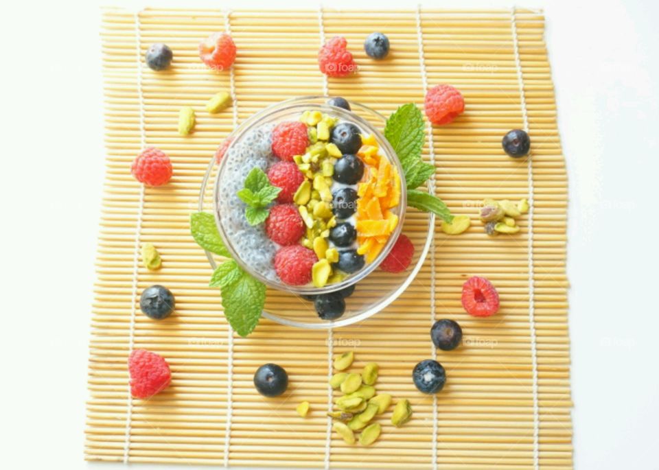 Smoothie Fresh Fruits Bowl - raspberry, blueberry,  mango, nuts and basil seeds