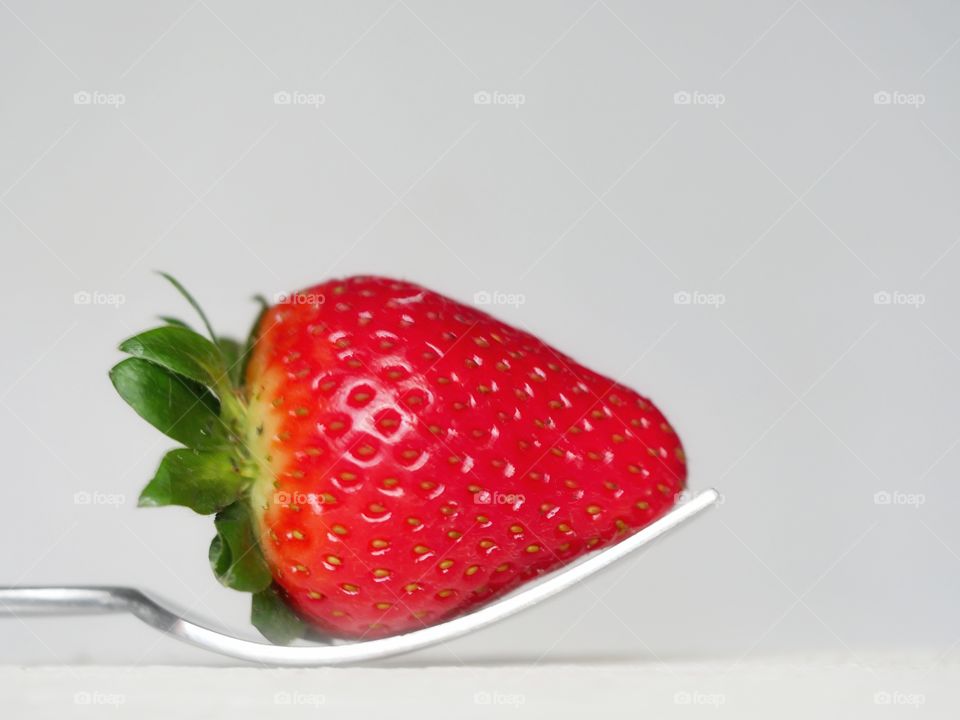 Strawberry on fork