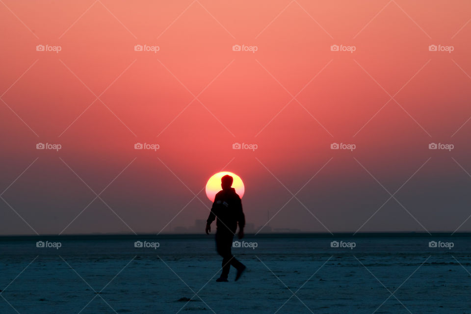 human silhouette captured during sunset in Rann of Kutch, India
