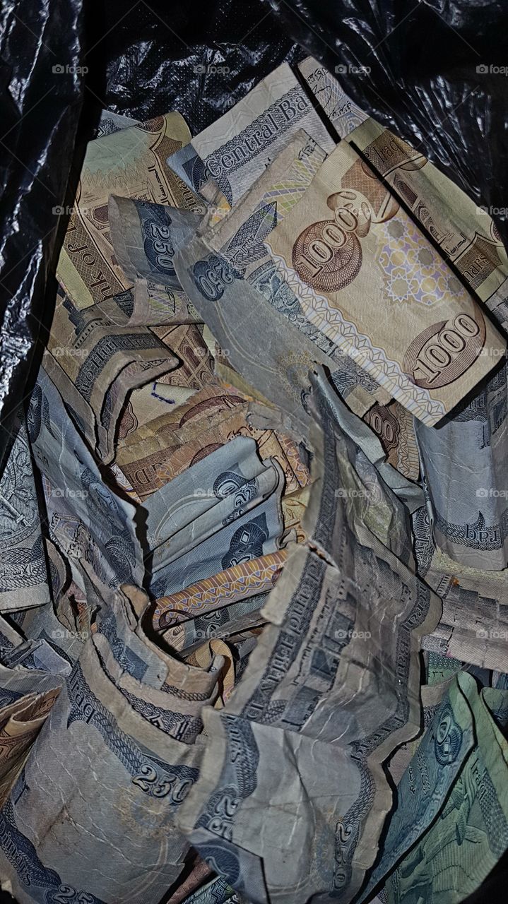 High angle view of damaged currency note