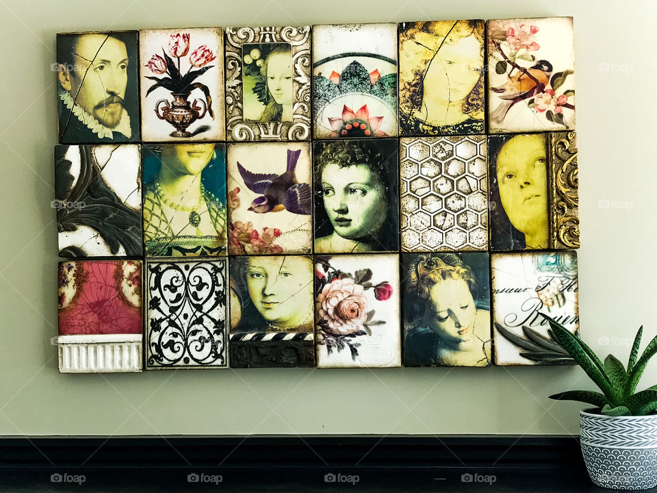 Not every rectangle has to be square! A rectangle of rectangular ceramic tiles over a fireplace mantel. The vintage looking Renaissance art tiles make a beautiful art piece but are not quite square to the wall...or are they?! ๐