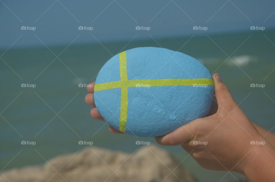 Flag of Sweden on a stone