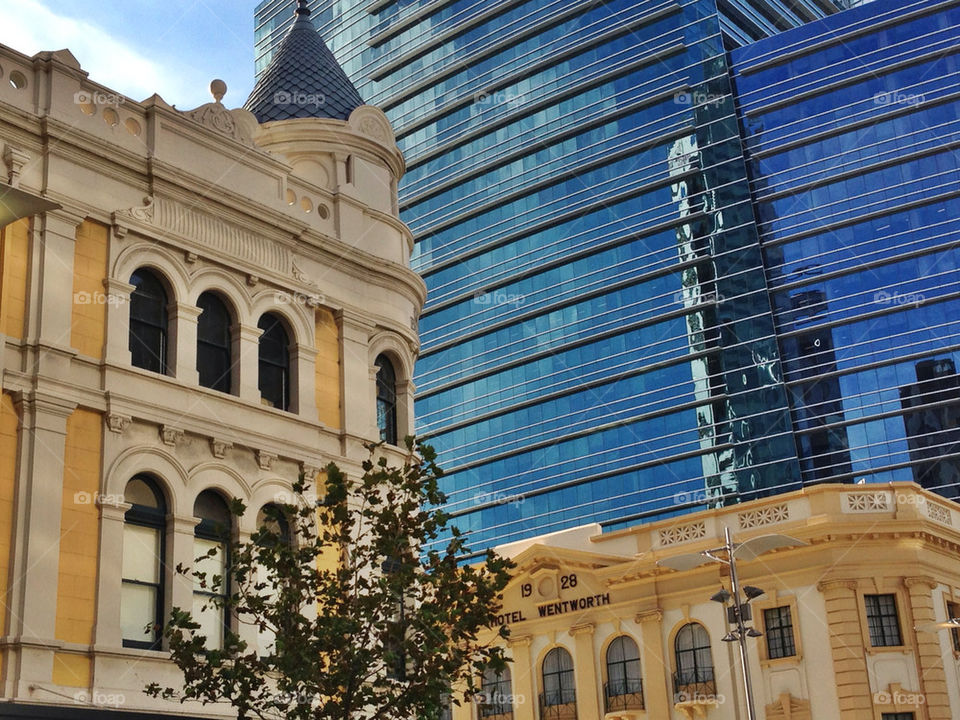 
Low angle view of modern hotel building in city