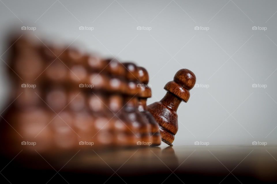 Curious wooden pawn