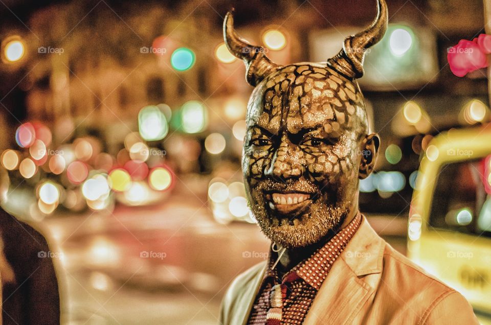 Man with horns smiling