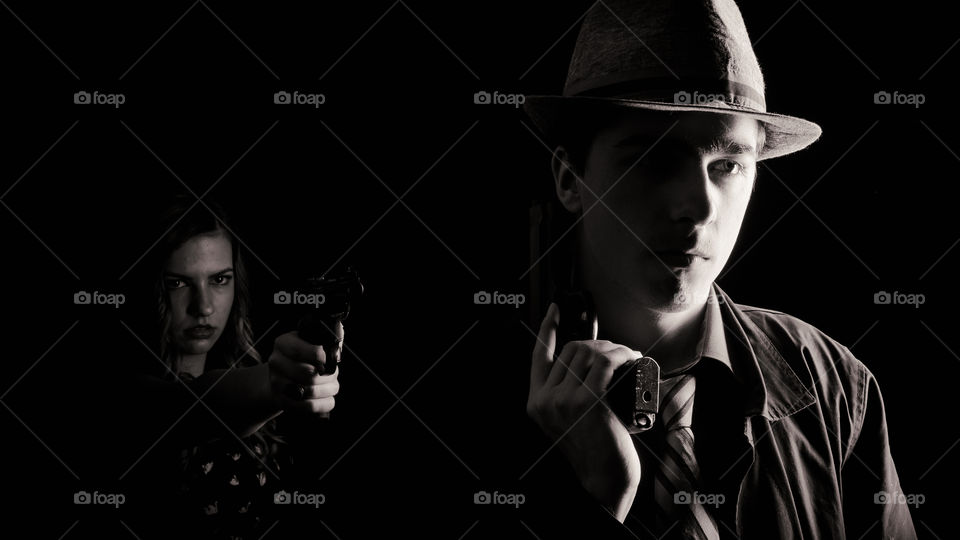 Man and woman holding gun
