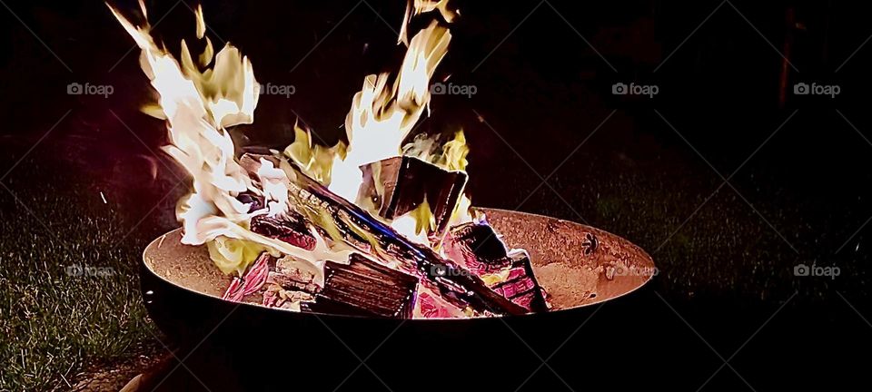 A bonfire burns joyously on a springtime night in 2023 in a garden somewhere in “Bavaria”, Germany. Hypnotic Productions