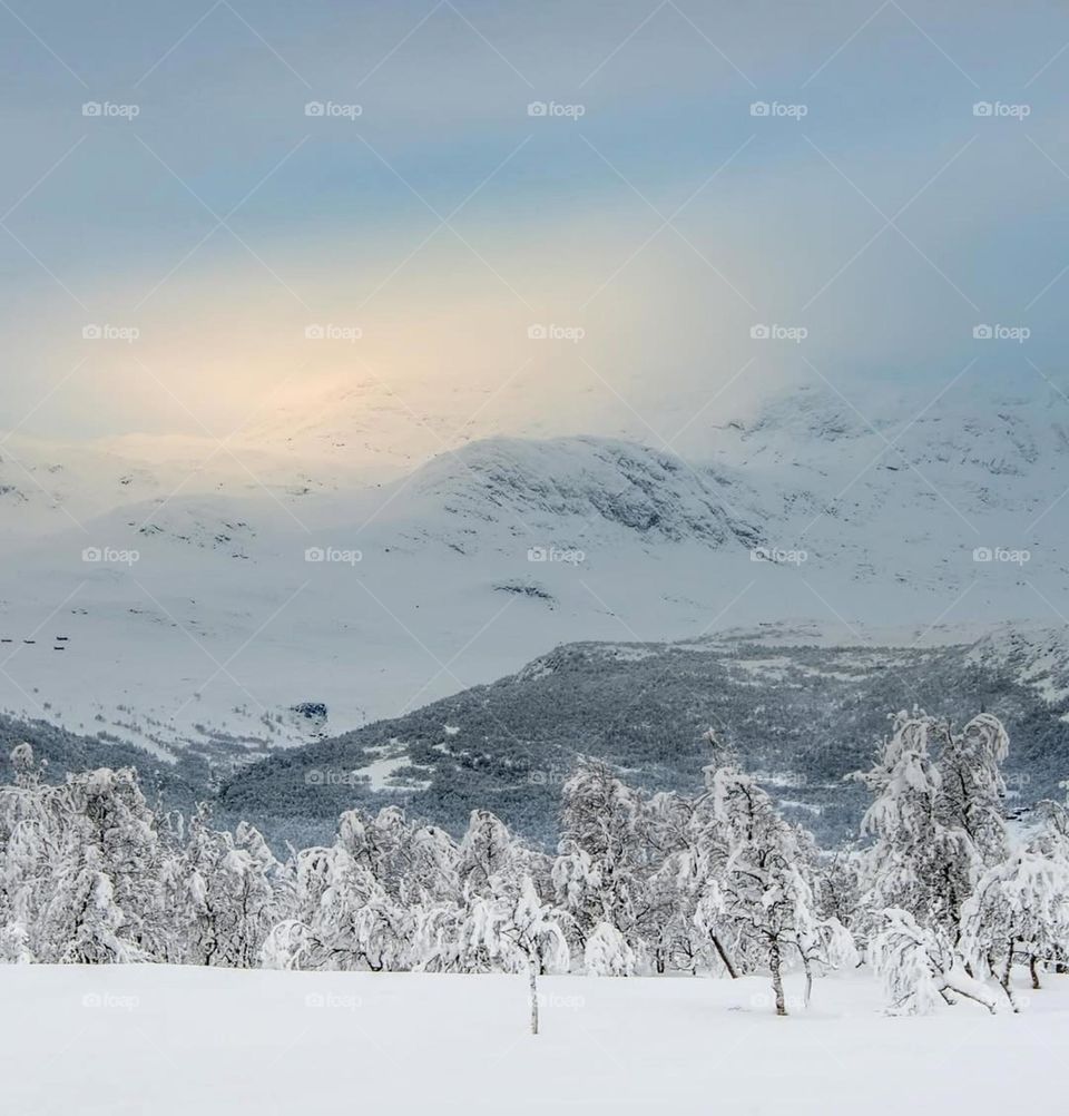 Silence speaks the loudest in the embrace of snowy peaks