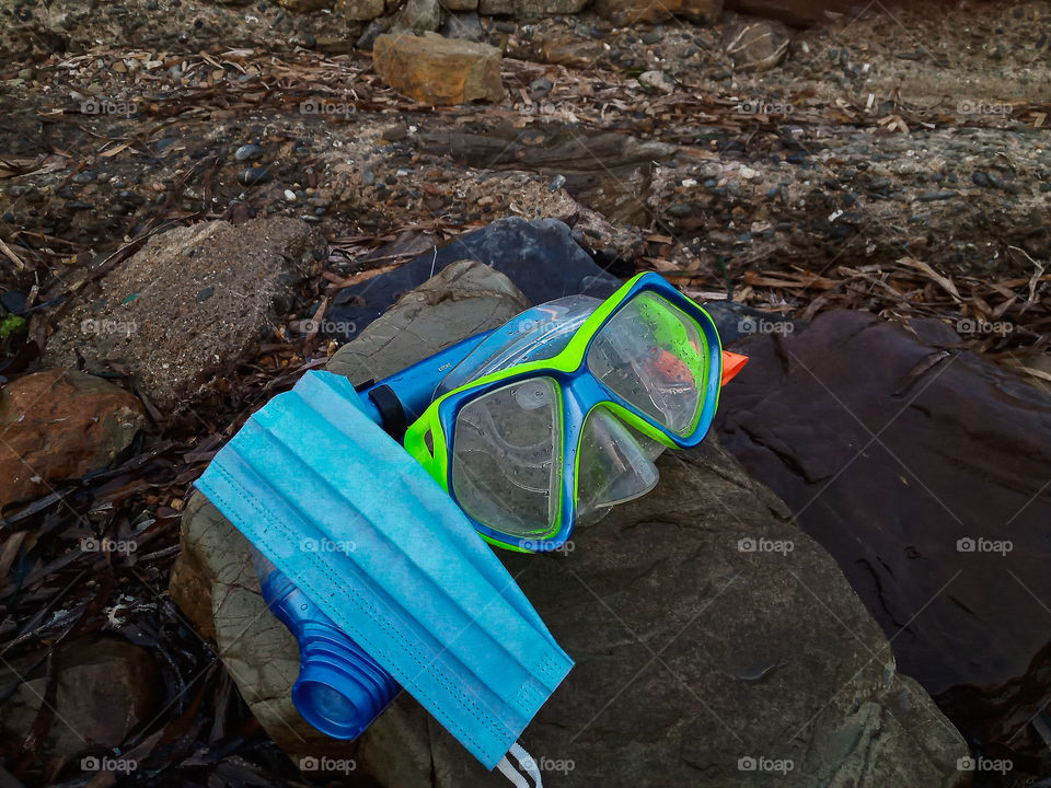 a surgical mask near a diving mask