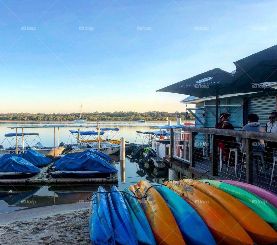 The kayak rental shop at the river in the morning light 