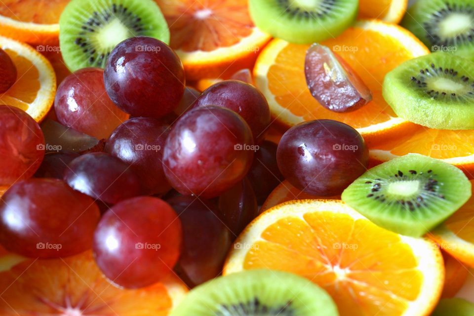 tropics fruits healthy food on a plate background