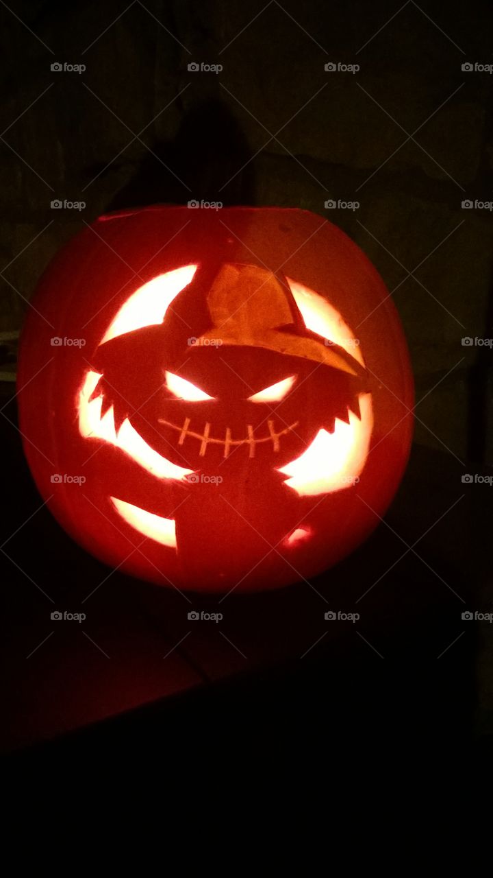 Carved scarecrow halloween pumpkin