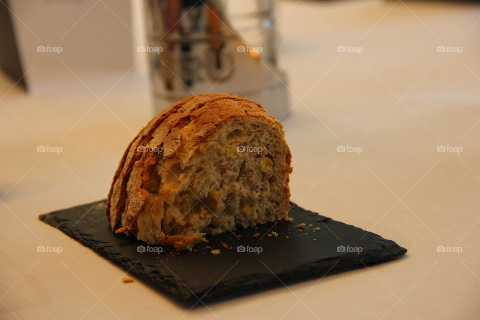 loaf of bread served on a stone