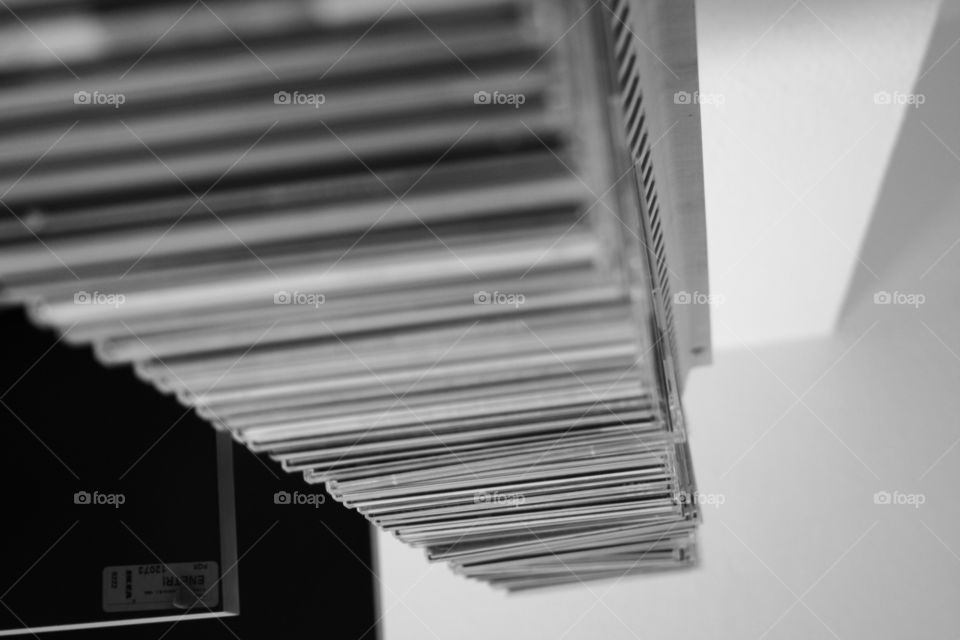 CD cases from above in black and white