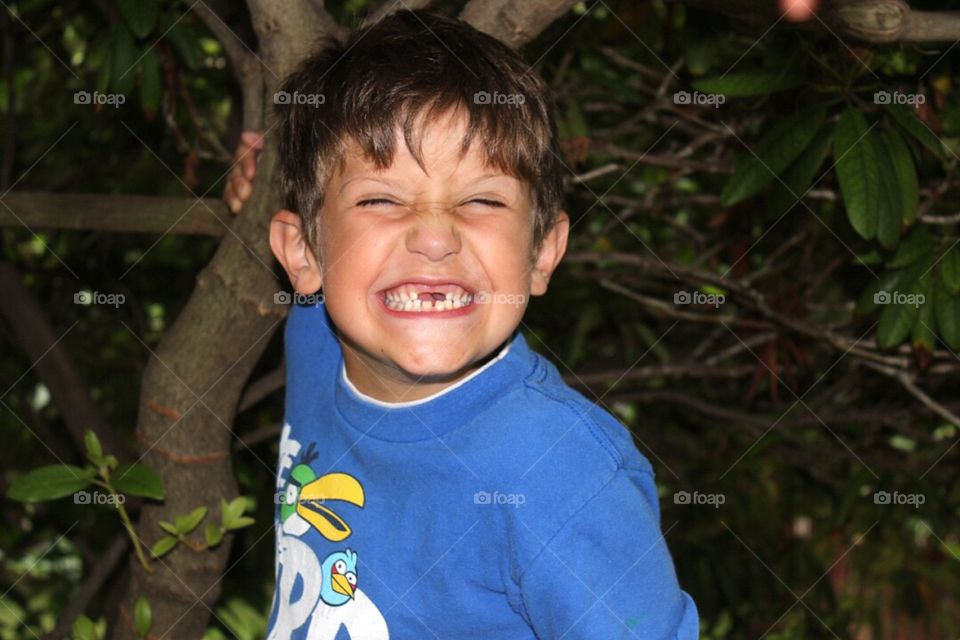 Close-up of a boy making face